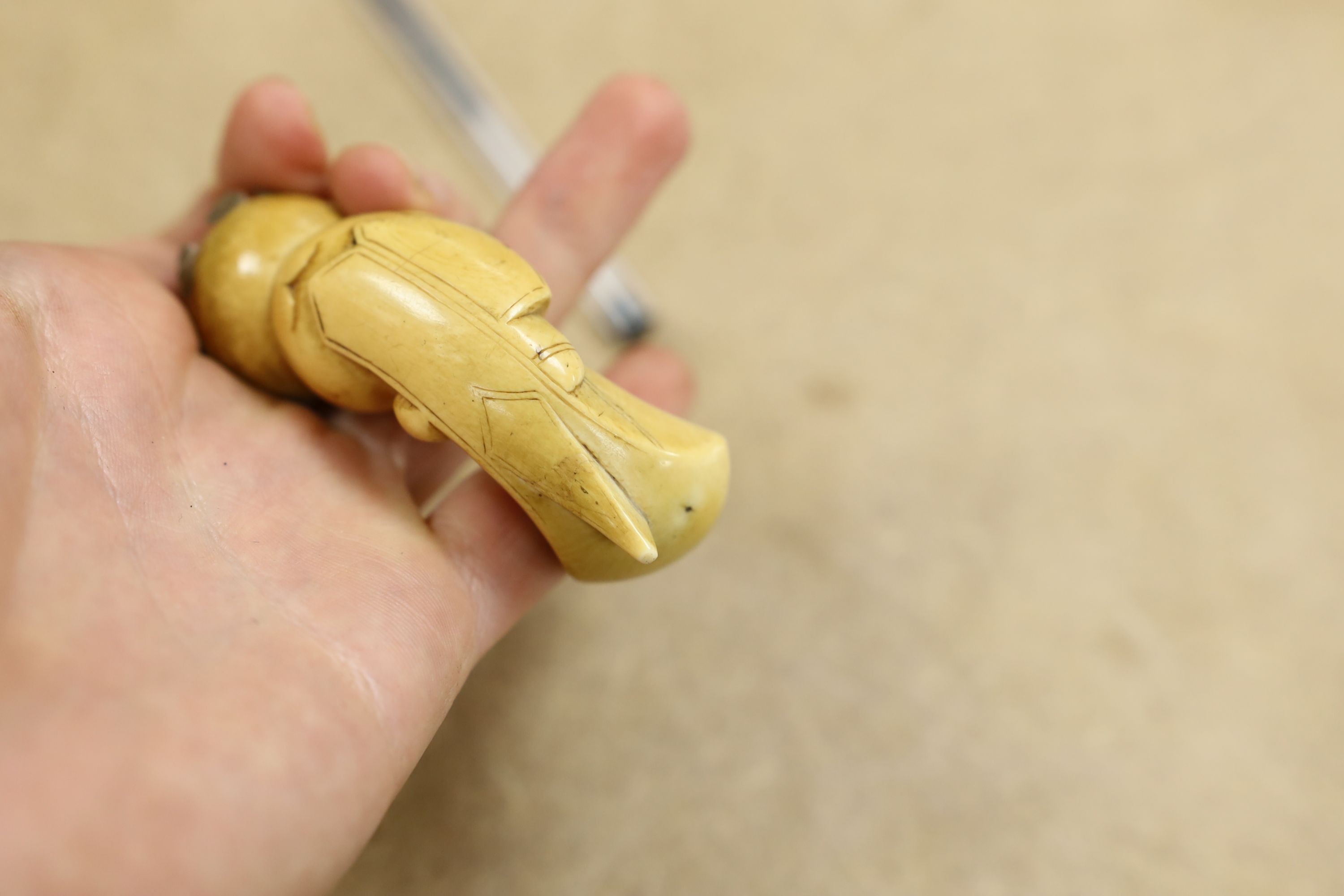 A 19th century ivory handled Kris, 40 cms long.